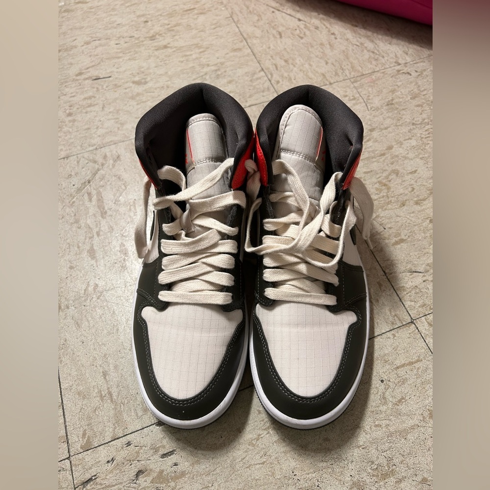 Black and cream high top shoes